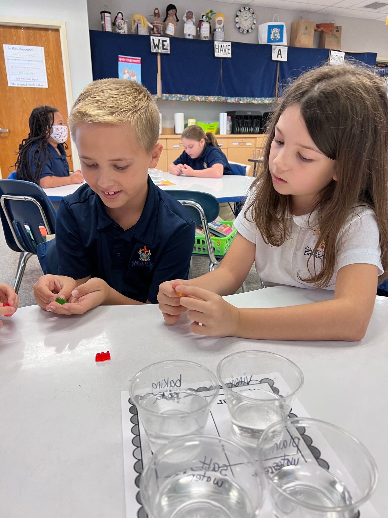 3rd grade doing a science lab in the classroom